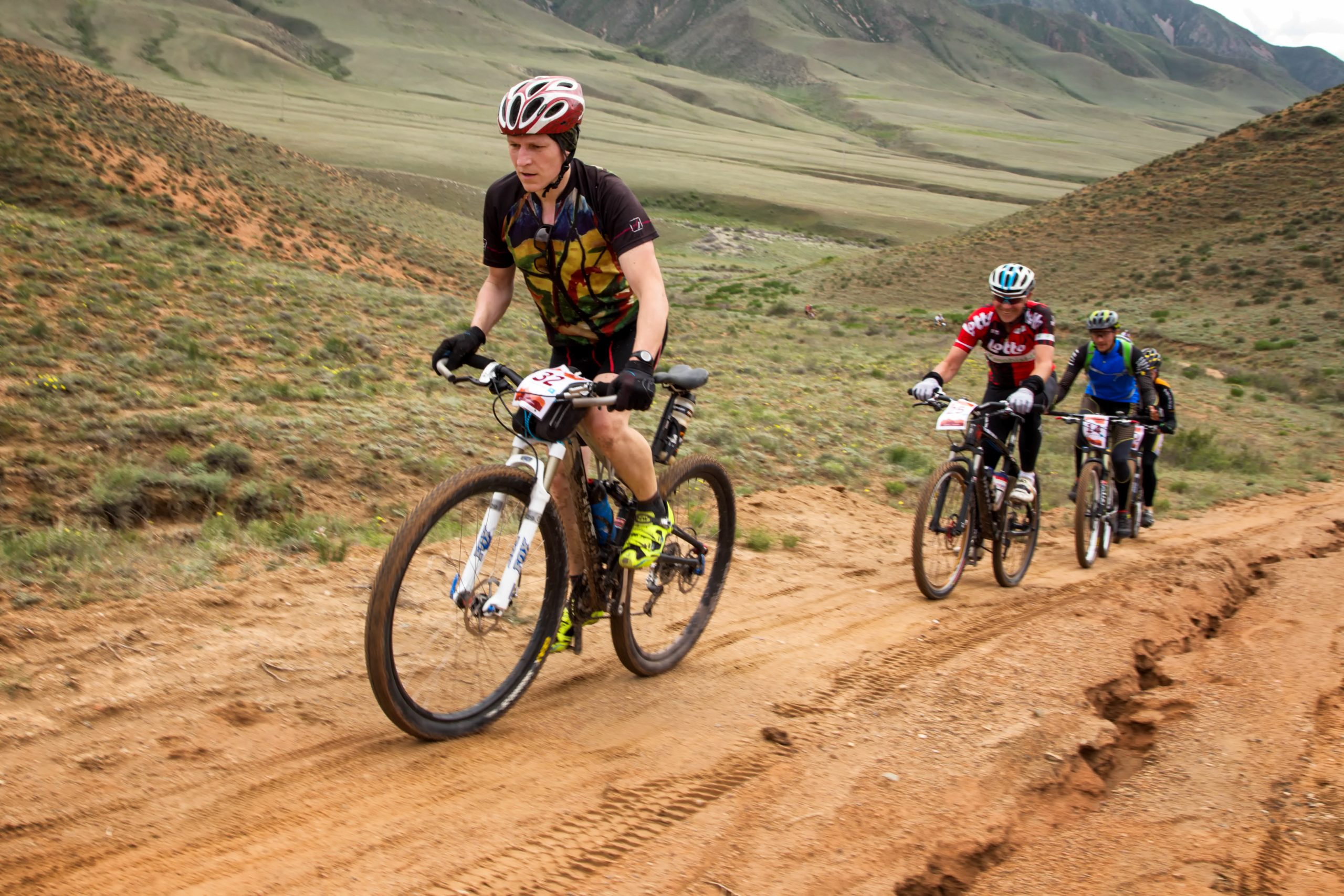 ALMATY, KAZAKHSTAN - APRIL 30, 2016: V.Kachanov (N32) in action at Adventure mountain bike cross-country competition in mountains "Jeyran Trophy 2016"